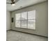 Bright bedroom with ceiling fan and large window at 238 Walker Sw St # 32, Atlanta, GA 30313