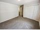 Bright bedroom with double door closet and carpet at 709 Tribal Trl, Woodstock, GA 30188