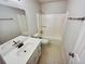 Bathroom with tub shower and double vanity at 709 Tribal Trl, Woodstock, GA 30188
