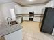 Spacious kitchen featuring granite countertops and stainless steel appliances at 709 Tribal Trl, Woodstock, GA 30188