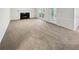 Living room with fireplace and access to backyard patio at 709 Tribal Trl, Woodstock, GA 30188