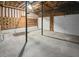 Unfinished basement with concrete floor and garage door at 709 Tribal Trl, Woodstock, GA 30188