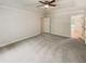 Main bedroom with carpet, door to bathroom and large window at 709 Tribal Trl, Woodstock, GA 30188