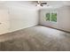 Large bedroom with ceiling fan and window, carpeted at 709 Tribal Trl, Woodstock, GA 30188