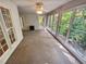 Sunroom with wood burning stove and walls of windows at 709 Tribal Trl, Woodstock, GA 30188