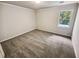 Bright bedroom with neutral walls and plush carpeting at 709 Tribal Trl, Woodstock, GA 30188