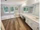 Bathroom with double vanity, garden tub, and updated flooring at 709 Tribal Trl, Woodstock, GA 30188