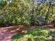 Wooded backyard with lush green grass at 709 Tribal Trl, Woodstock, GA 30188