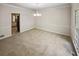 Bright dining room with neutral walls and carpet at 709 Tribal Trl, Woodstock, GA 30188
