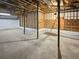 Unfinished basement with exposed beams and concrete floor at 709 Tribal Trl, Woodstock, GA 30188