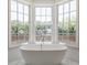Luxurious bathroom featuring a freestanding tub and large windows at 2701 Southwell St, Atlanta, GA 30305