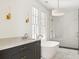 Spa-like bathroom with freestanding tub, marble floors, and walk-in shower at 2701 Southwell St, Atlanta, GA 30305