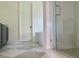 Bathroom with marble flooring, a freestanding tub, and glass shower at 2701 Southwell St, Atlanta, GA 30305
