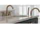 Bathroom with a marble countertop and modern gold fixtures at 2701 Southwell St, Atlanta, GA 30305