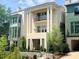 Beige three-story home with balcony and landscaping at 2701 Southwell St, Atlanta, GA 30305