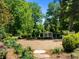 Landscaped garden with gravel pathway, benches, and lush greenery at 2701 Southwell St, Atlanta, GA 30305