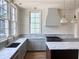 Modern kitchen with white cabinets, marble counters, and island at 2701 Southwell St, Atlanta, GA 30305