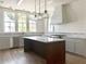 Modern kitchen with white cabinets, marble counters, and island at 2701 Southwell St, Atlanta, GA 30305