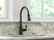 Close-up of a kitchen sink with a modern bronze faucet at 2701 Southwell St, Atlanta, GA 30305