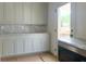 Well-equipped kitchenette with light cabinets and marble countertops at 2701 Southwell St, Atlanta, GA 30305