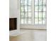 Living room with fireplace and large windows offering natural light at 2701 Southwell St, Atlanta, GA 30305