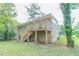 Back of house showcasing deck, stairs, and a partially visible yard at 1278 Lynwyn Se Ln, Atlanta, GA 30316