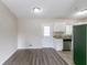 Dining area with gray vinyl plank floors and white door to outside at 1278 Lynwyn Se Ln, Atlanta, GA 30316