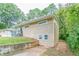Side view of tan brick ranch house with landscaping at 1278 Lynwyn Se Ln, Atlanta, GA 30316