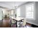 Modern dining area with light wood table and stylish chairs at 943 Rose Sw Cir, Atlanta, GA 30310