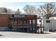 Boxcar Hop City West End restaurant exterior, brick building with outdoor patio and stairs at 943 Rose Sw Cir, Atlanta, GA 30310