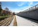 Concrete walking trail next to a brick wall at 943 Rose Sw Cir, Atlanta, GA 30310