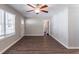 Living room with hardwood floors, neutral walls, and a ceiling fan at 1371 Varner Rd, Marietta, GA 30062