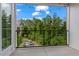 Private balcony overlooking a wooded area with string lights at 201 Devore Rd, Alpharetta, GA 30009