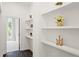 Hallway with built-in shelves and hardwood floors at 201 Devore Rd, Alpharetta, GA 30009