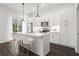 Modern kitchen with white cabinets, stainless steel appliances, and island at 201 Devore Rd, Alpharetta, GA 30009