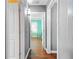 Bright hallway with hardwood floors and access to bedrooms at 1273 Boulevard Lorraine Sw, Atlanta, GA 30311