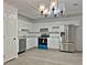 Modern kitchen with white cabinets, stainless steel appliances, and marble countertops at 226 Oak Hill Ct, Lithia Springs, GA 30122