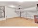 Spacious garage with overhead storage and neutral flooring at 116 Paulownia Cir, Mcdonough, GA 30253