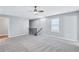 Bright loft area with ceiling fan and neutral carpeting at 116 Paulownia Cir, Mcdonough, GA 30253