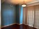 Bright dining room with hardwood floors and blue accent wall at 195 14Th Ne St # 2103, Atlanta, GA 30309