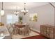 Formal dining area featuring a statement chandelier and hardwood floors at 3124 Bentgrass Ln, Kennesaw, GA 30144