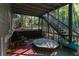 Screened porch with wooden stairs, seating, and a covered area at 1512 Silver Maple Sw Ct, Lilburn, GA 30047