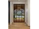 Light-filled entryway with arched glass door and hardwood floors at 95 Montgomery Ferry Ne Dr, Atlanta, GA 30309