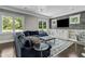 Gathering room with stone accent wall, built-ins, and a large TV at 343 Sterling St, Atlanta, GA 30307