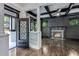 Elegant entryway with black metal door and hardwood floors at 343 Sterling St, Atlanta, GA 30307