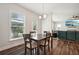 Breakfast nook with a table and chairs, near sliding door to backyard at 6172 Collins Nw Rd, Acworth, GA 30101