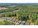 Aerial view of homes showcasing a community with wooded area at 6172 Collins Nw Rd, Acworth, GA 30101