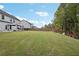 Landscaped backyard with large grassy area at 6172 Collins Nw Rd, Acworth, GA 30101