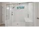 Large walk-in shower with a built-in seat and glass enclosure at 6172 Collins Nw Rd, Acworth, GA 30101