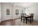 Bright dining room features a wood table with six chairs and a built-in hutch at 6172 Collins Nw Rd, Acworth, GA 30101